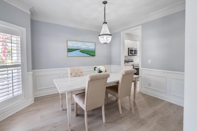 1250 White Tail Path, Charleston, SC 29414 - dining area featuring a chandelier, crown molding, light wood-style flooring, wainscoting, and a decorative wall