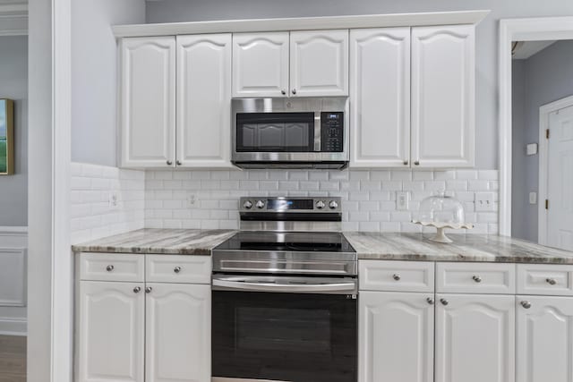 1250 White Tail Path, Charleston, SC 29414 - kitchen featuring stainless steel appliances, white cabinets, and light stone counters