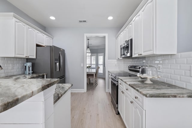 1250 White Tail Path, Charleston, SC 29414 - kitchen featuring appliances with stainless steel finishes, white cabinetry, recessed lighting, light wood-style floors, and backsplash