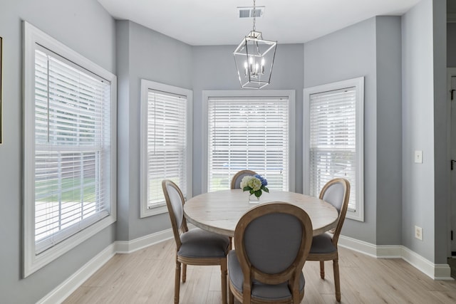 1250 White Tail Path, Charleston, SC 29414 - dining area featuring light wood-style floors, a chandelier, and baseboards