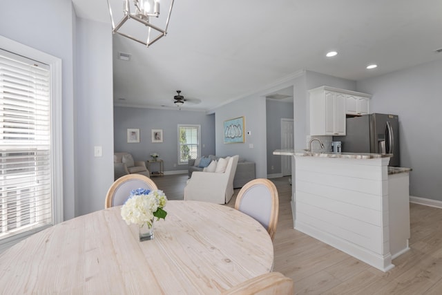 1250 White Tail Path, Charleston, SC 29414 - dining area featuring baseboards, light wood-type flooring, recessed lighting, crown molding, and a ceiling fan
