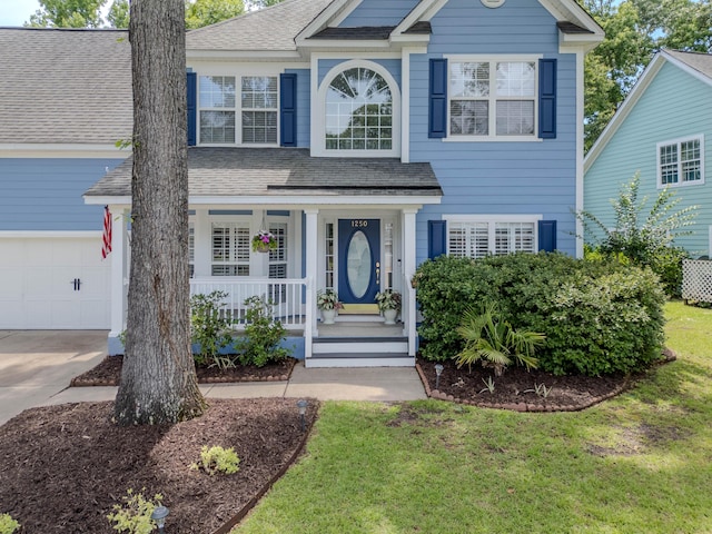 1250 White Tail Path, Charleston, SC 29414 - traditional-style home featuring covered porch, roof with shingles, a front yard, and driveway