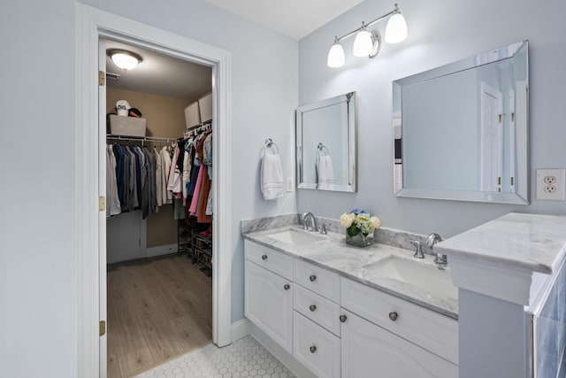 1250 White Tail Path, Charleston, SC 29414 - full bath featuring double vanity, a spacious closet, tile patterned flooring, and baseboards
