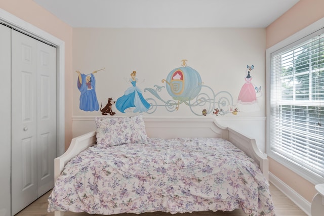 1250 White Tail Path, Charleston, SC 29414 - bedroom with a closet, baseboards, and wood finished floors