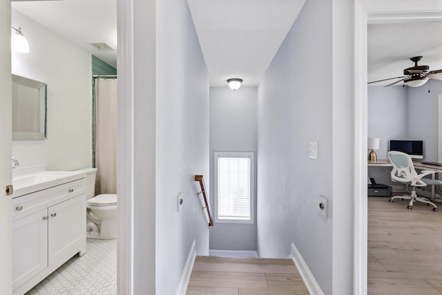 1250 White Tail Path, Charleston, SC 29414 - staircase with ceiling fan, wood finished floors, and baseboards