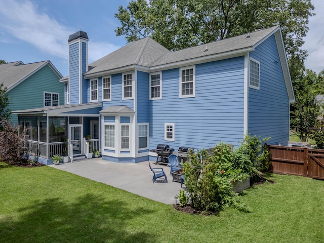 1250 White Tail Path, Charleston, SC 29414 - back of house featuring a sunroom, a patio area, a chimney, and roof with shingles