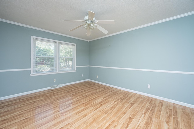 spare room featuring crown molding, ceiling fan, a textured ceiling, and light hardwood / wood-style floors