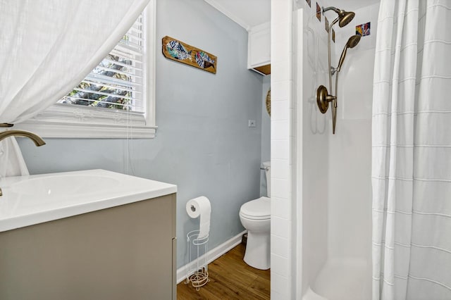 bathroom with wood-type flooring, toilet, vanity, and a shower with shower curtain