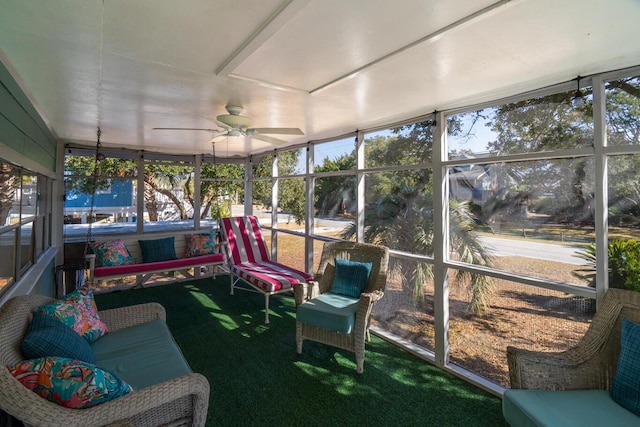 sunroom featuring ceiling fan