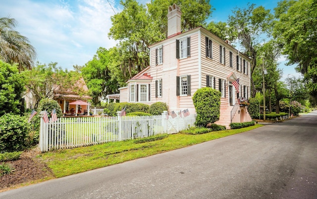 view of property exterior featuring a lawn