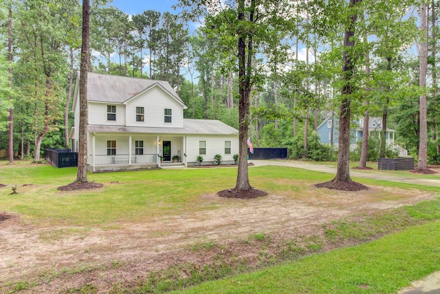 6190 Button Bush Dr, Ravenel, SC 29470 - view of front of property with covered porch, a front yard, and concrete driveway