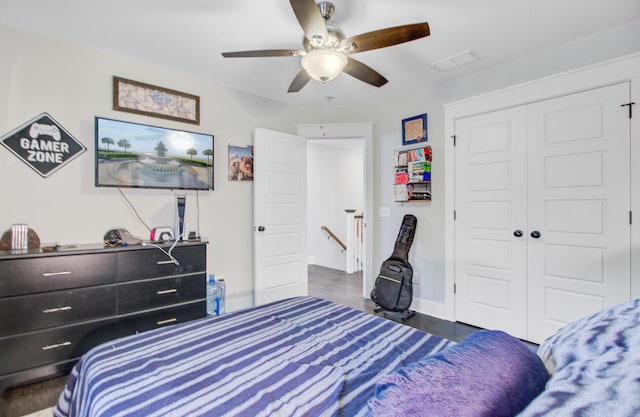 6190 Button Bush Dr, Ravenel, SC 29470 - bedroom with a closet, ceiling fan, and wood finished floors