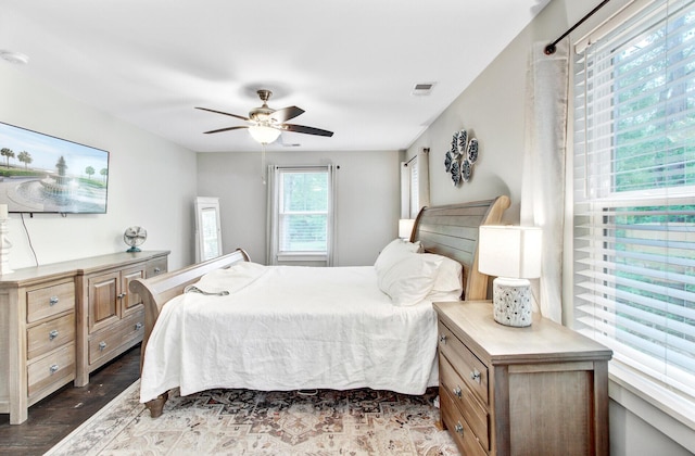6190 Button Bush Dr, Ravenel, SC 29470 - bedroom featuring dark wood-style flooring and ceiling fan