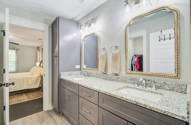 6190 Button Bush Dr, Ravenel, SC 29470 - ensuite bathroom with double vanity, wood finished floors, and a walk in closet