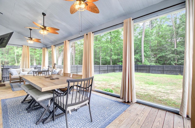 6190 Button Bush Dr, Ravenel, SC 29470 - sunroom with vaulted ceiling, outdoor dining space, ceiling fan, and outdoor lounge area