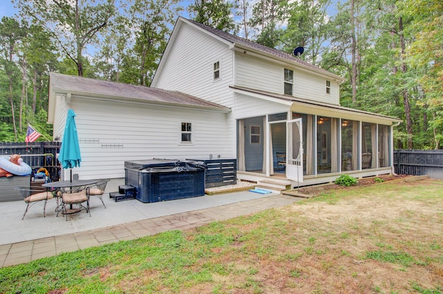 6190 Button Bush Dr, Ravenel, SC 29470 - back of property featuring a sunroom, a patio area, and a hot tub