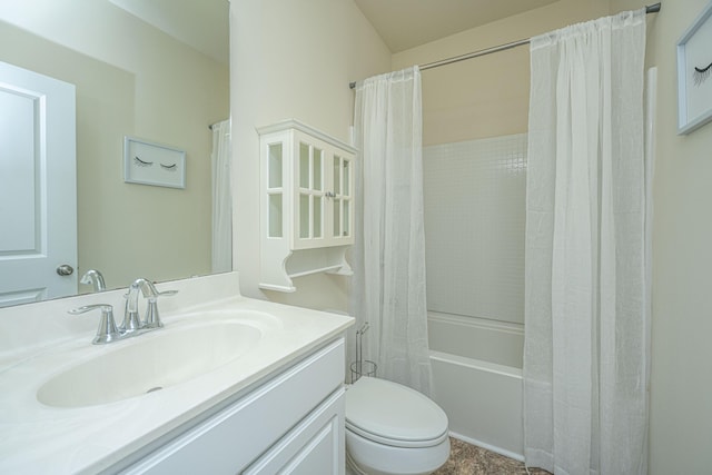 full bathroom featuring vanity, shower / bath combo with shower curtain, and toilet
