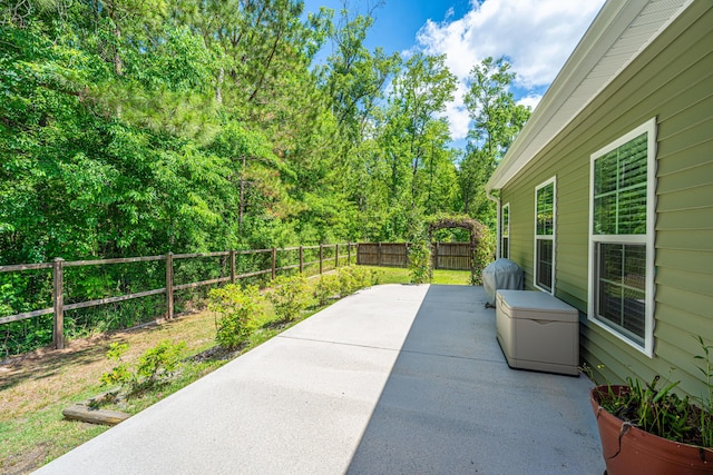 view of patio featuring a fenced backyard and a grill