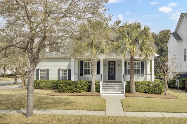 view of front of home featuring covered porch and a front lawn