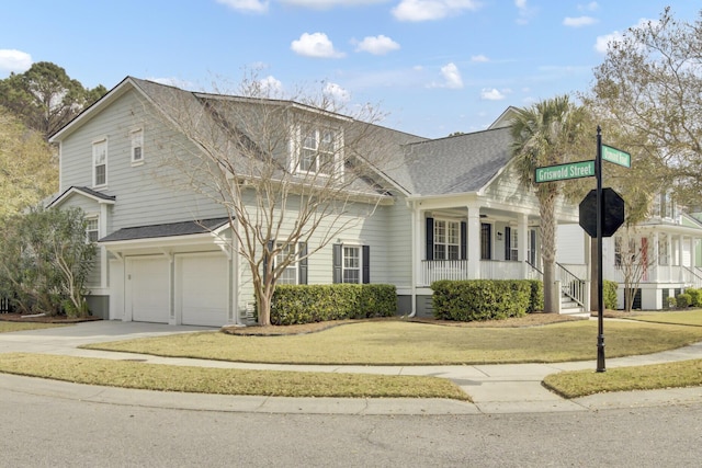 view of front of property with a shingled roof, a front lawn, a porch, concrete driveway, and a garage