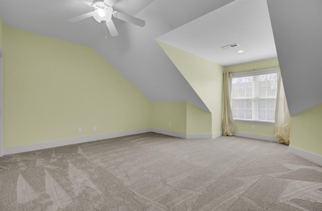 bonus room featuring visible vents, baseboards, carpet, and lofted ceiling