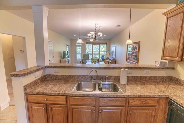 kitchen with light tile patterned floors, pendant lighting, an inviting chandelier, sink, and kitchen peninsula