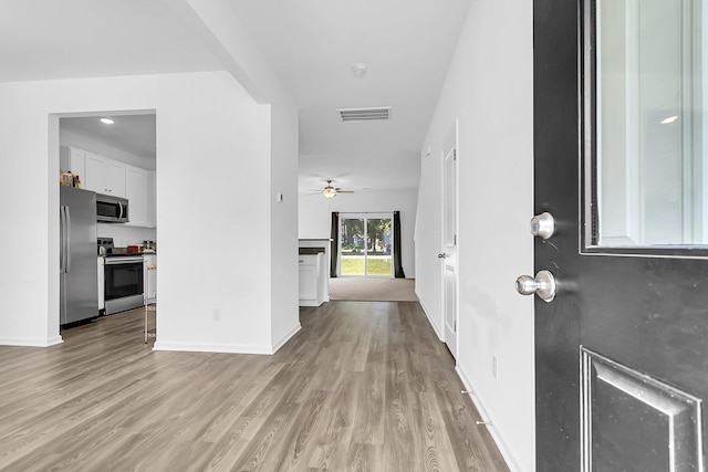 corridor featuring light wood-type flooring