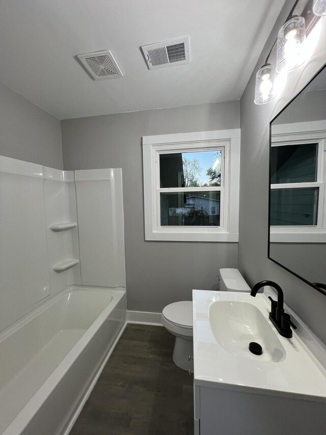 105 Bermuda Ct, Summerville, SC 29485 - full bathroom with baseboards, toilet, vanity, wood finished floors, and bathing tub / shower combination