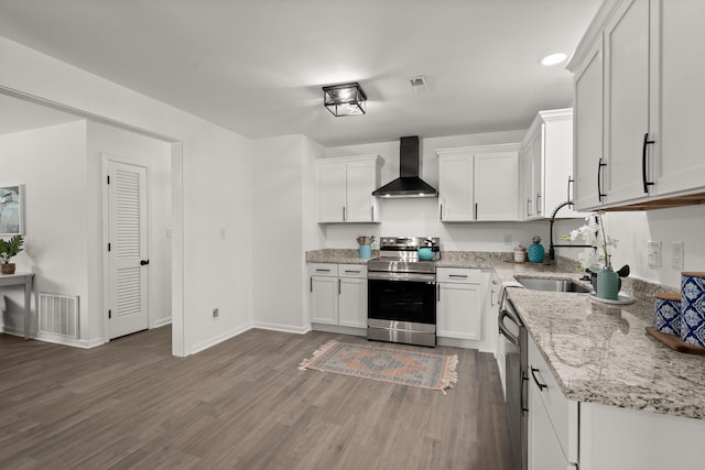 105 Bermuda Ct, Summerville, SC 29485 - kitchen with stainless steel electric range oven, wall chimney exhaust hood, wood finished floors, white cabinets, and light stone counters
