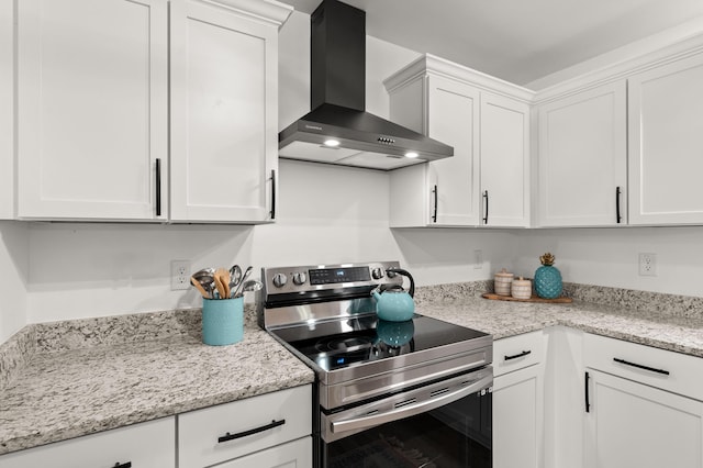 105 Bermuda Ct, Summerville, SC 29485 - kitchen with electric stove, wall chimney range hood, white cabinetry, and light stone counters