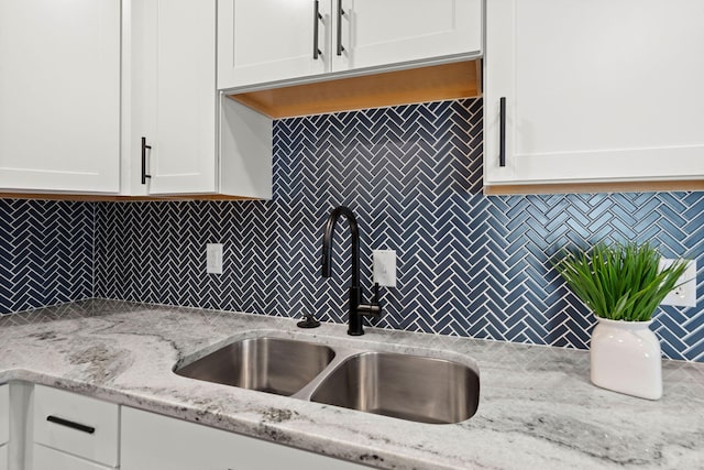 105 Bermuda Ct, Summerville, SC 29485 - kitchen with a sink, backsplash, and white cabinetry