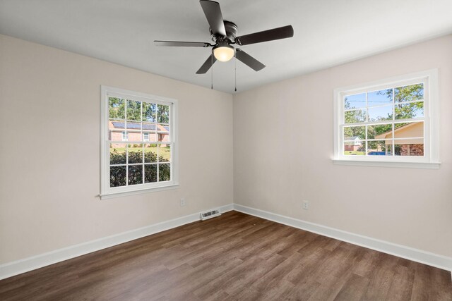 105 Bermuda Ct, Summerville, SC 29485 - spare room featuring dark wood-type flooring, plenty of natural light, baseboards, and a ceiling fan