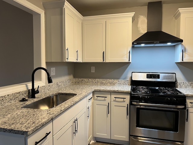 105 Bermuda Ct, Summerville, SC 29485 - kitchen featuring wall chimney exhaust hood, stainless steel gas range oven, a sink, light stone counters, and white cabinets