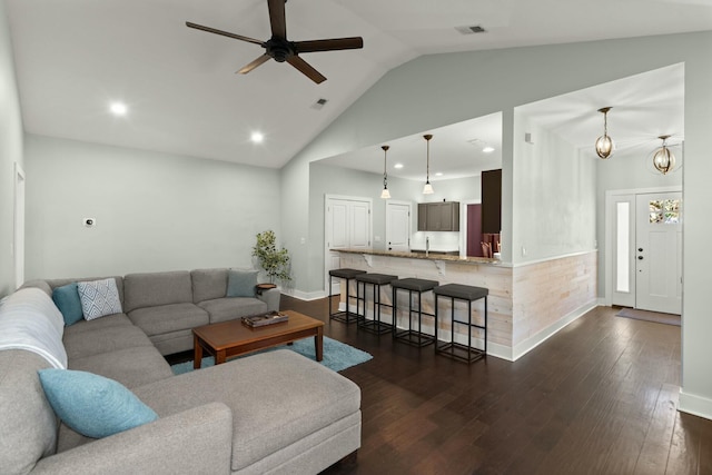 living area with visible vents, baseboards, dark wood finished floors, recessed lighting, and ceiling fan with notable chandelier