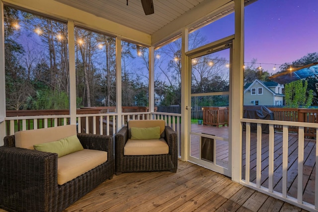 sunroom / solarium with ceiling fan