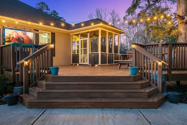 wooden terrace featuring a sunroom