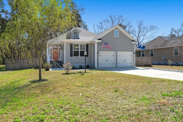 view of front of home with a garage, concrete driveway, a front lawn, and fence