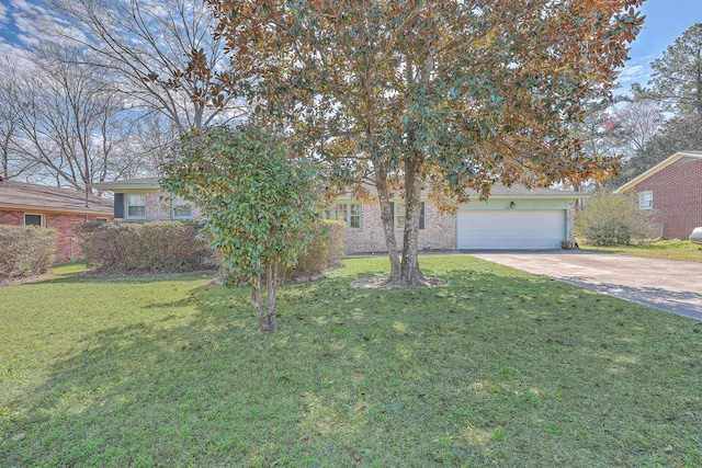 obstructed view of property with a front lawn, brick siding, driveway, and an attached garage