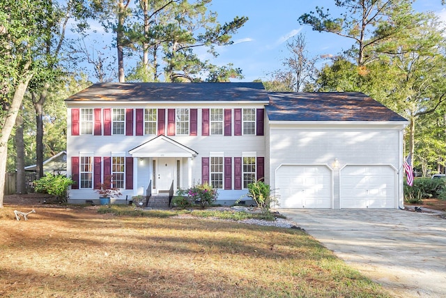 colonial inspired home featuring a garage