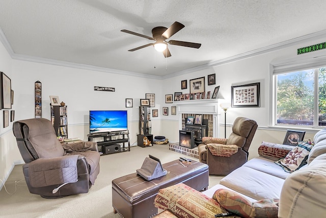 carpeted living room with a textured ceiling, a fireplace, ceiling fan, and crown molding