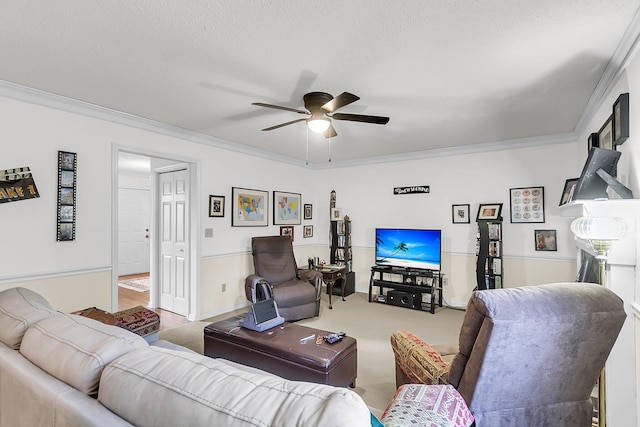 carpeted living room with a textured ceiling, ceiling fan, and ornamental molding