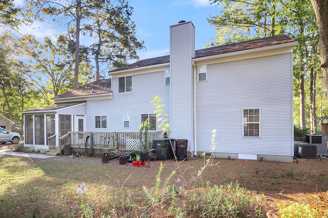 back of property with central AC, a sunroom, and a deck