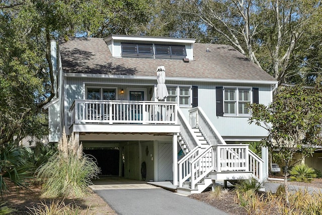 raised beach house with a carport and a porch