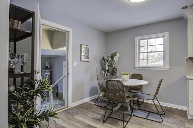 dining space featuring light hardwood / wood-style floors