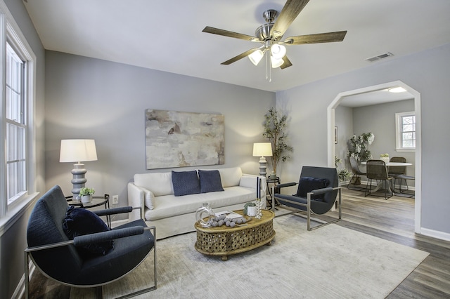 living room with hardwood / wood-style floors and ceiling fan