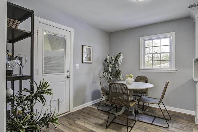 dining room with hardwood / wood-style floors