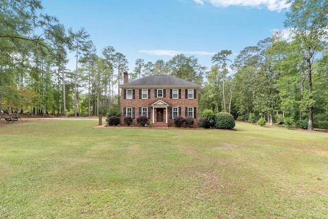 colonial home with a front yard