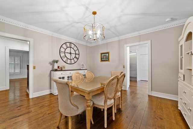 dining room with an inviting chandelier, crown molding, and dark hardwood / wood-style flooring