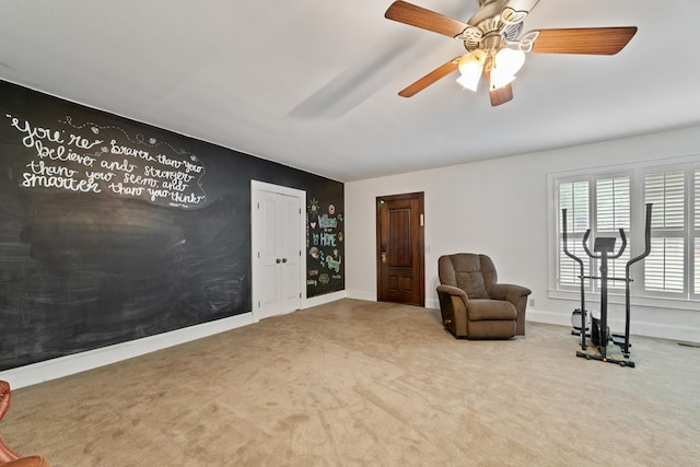 unfurnished room featuring ceiling fan and light colored carpet