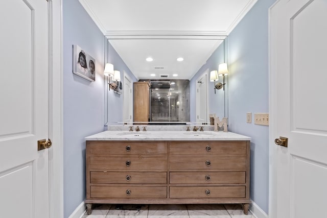 bathroom featuring ornamental molding and vanity